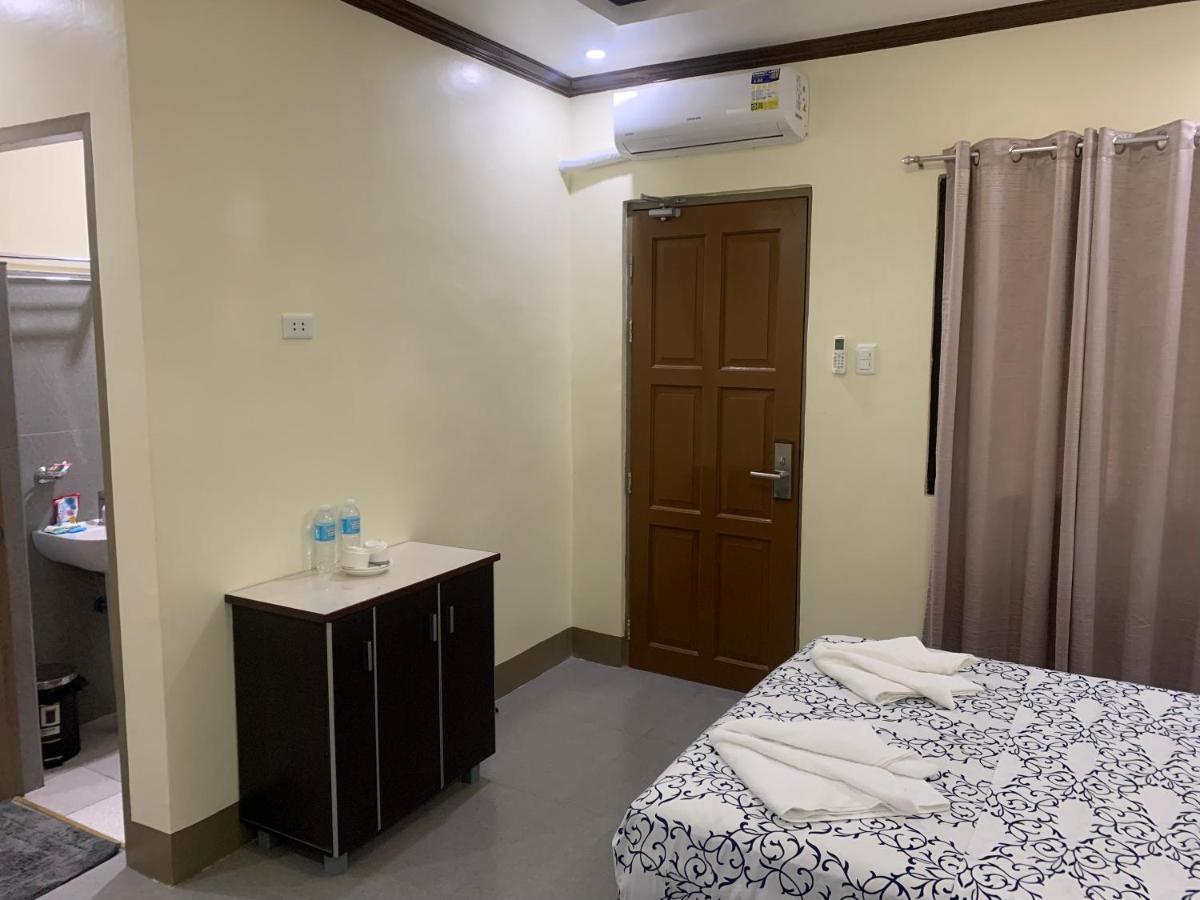 Zl Travelers Inn Batuan Buitenkant foto
